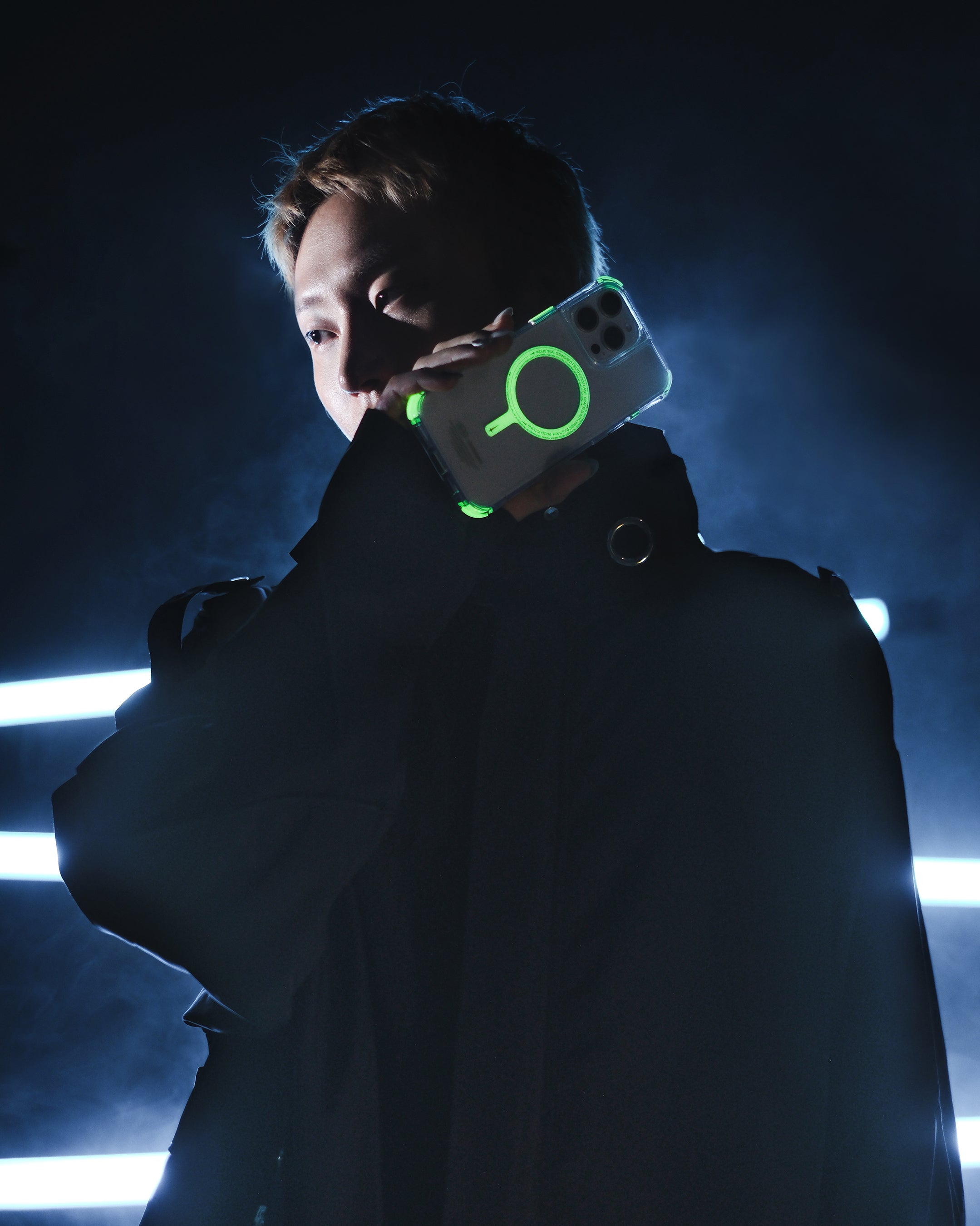 Man holding SAIDO NITEGLOW phone case with glow-in-the-dark trimmings